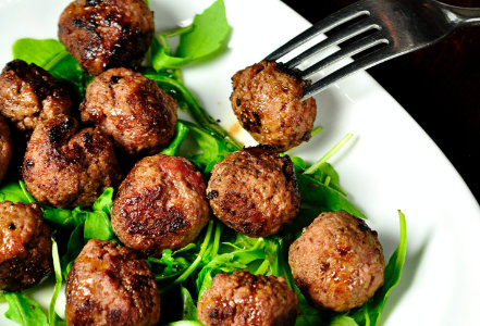 Meatball dish with leafy greens